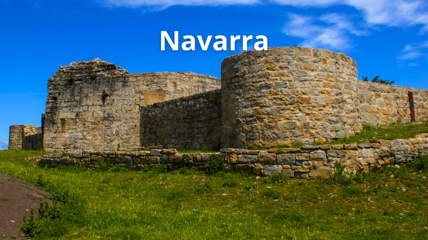 Foto de un castillo navarro con el texto sobreimpreso: Navarra.